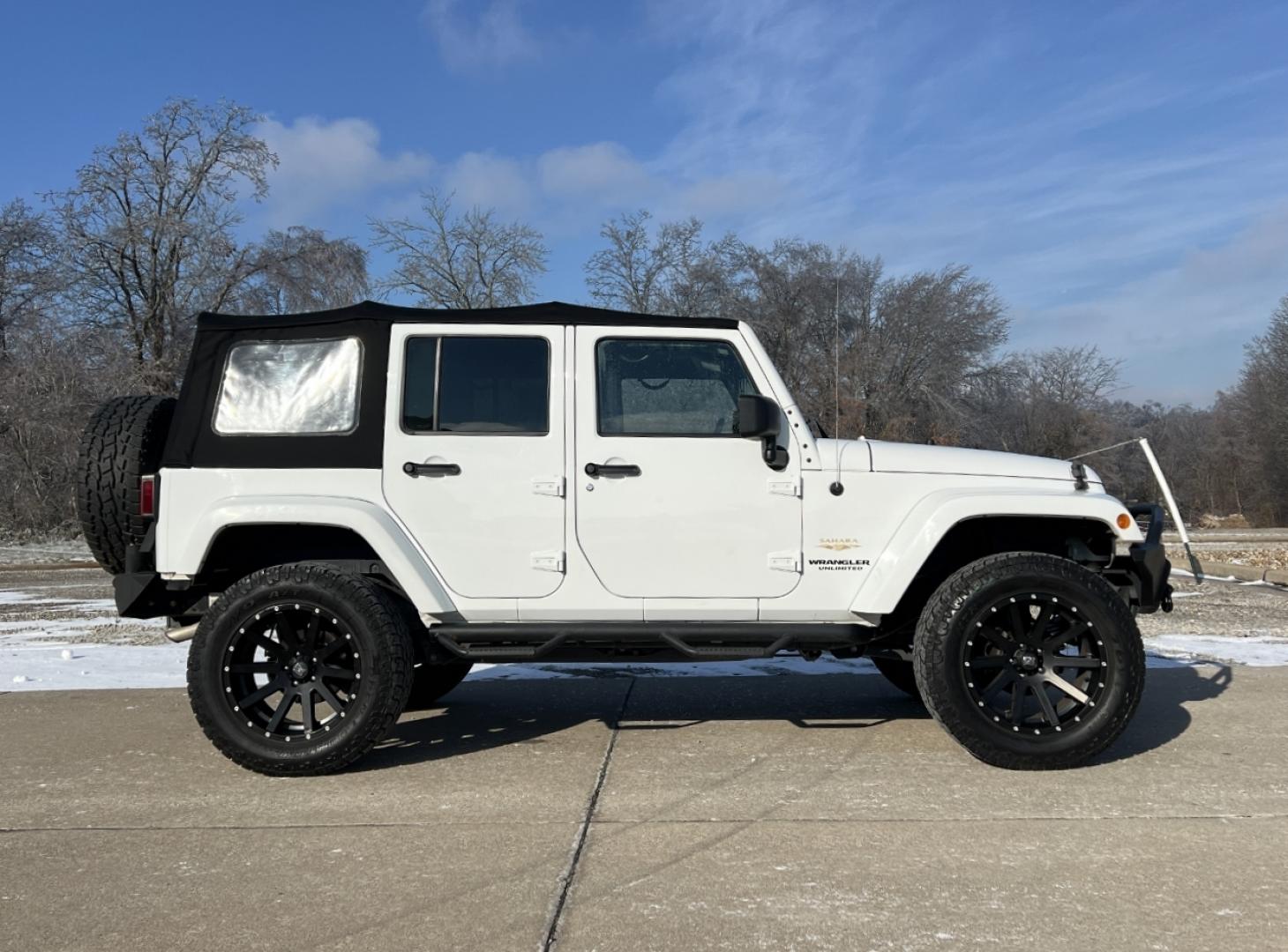 2014 WHITE /Black Cloth Jeep Wrangler Unlimited Sahara (1C4BJWEG1EL) with an 3.6L V6 engine, Automatic transmission, located at 506 S. Kingshighway, Cape Girardeau, MO, 63703, (573) 235-5000, 37.294991, -89.553635 - 2014 Jeep Wrangler Unlimited Sahara Only 48xxx miles 4x4 3.6L V6 Automatic Local Trade-In 20" Wheels Cruise Power Windows/Locks/Mirrors We have financing available and we accept trades! Fill out a credit application on our website or come by today! If you have any questions, give us a call - Photo#5