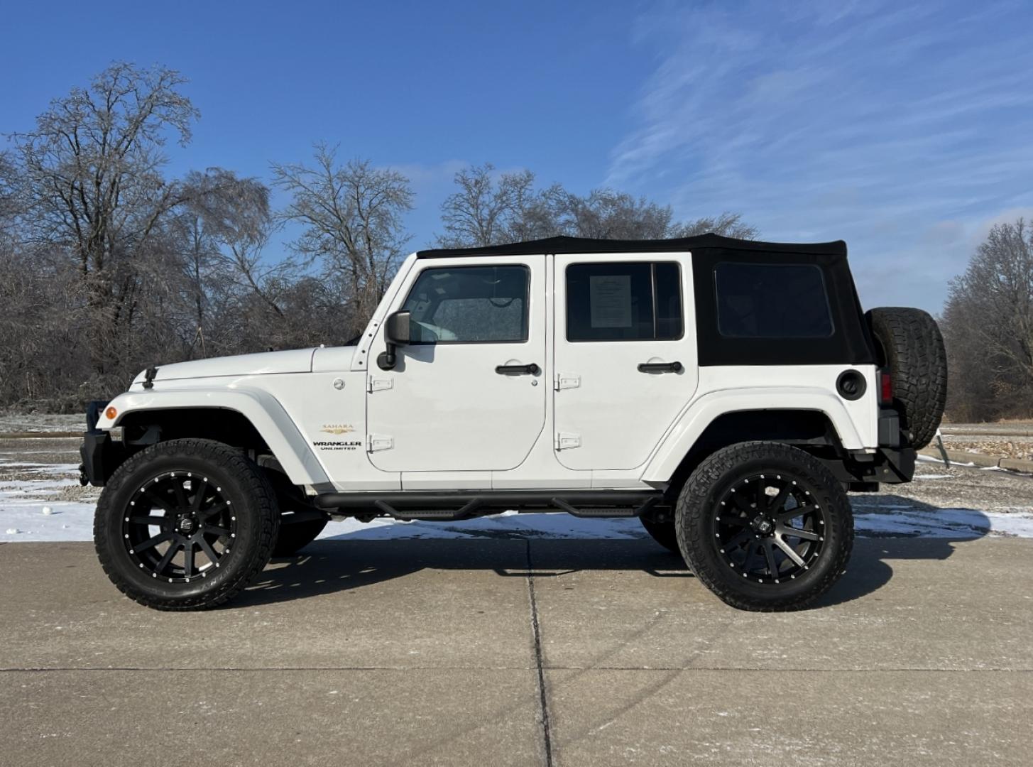 2014 WHITE /Black Cloth Jeep Wrangler Unlimited Sahara (1C4BJWEG1EL) with an 3.6L V6 engine, Automatic transmission, located at 506 S. Kingshighway, Cape Girardeau, MO, 63703, (573) 235-5000, 37.294991, -89.553635 - 2014 Jeep Wrangler Unlimited Sahara Only 48xxx miles 4x4 3.6L V6 Automatic Local Trade-In 20" Wheels Cruise Power Windows/Locks/Mirrors We have financing available and we accept trades! Fill out a credit application on our website or come by today! If you have any questions, give us a call - Photo#4