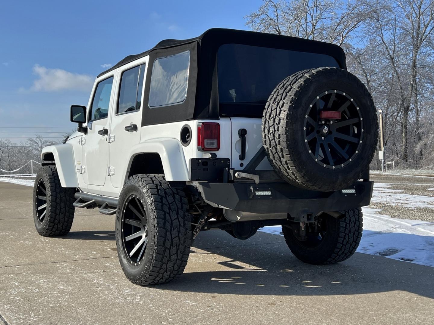 2014 WHITE /Black Cloth Jeep Wrangler Unlimited Sahara (1C4BJWEG1EL) with an 3.6L V6 engine, Automatic transmission, located at 506 S. Kingshighway, Cape Girardeau, MO, 63703, (573) 235-5000, 37.294991, -89.553635 - 2014 Jeep Wrangler Unlimited Sahara Only 48xxx miles 4x4 3.6L V6 Automatic Local Trade-In 20" Wheels Cruise Power Windows/Locks/Mirrors We have financing available and we accept trades! Fill out a credit application on our website or come by today! If you have any questions, give us a call - Photo#7