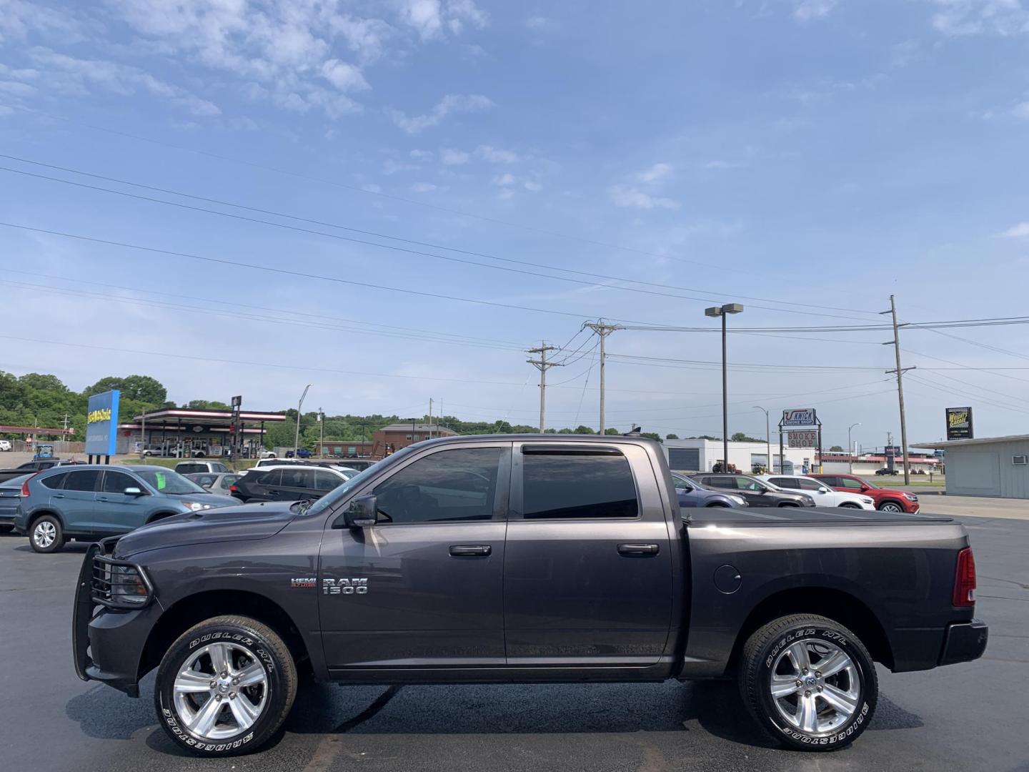 2015 GRAY /Black Leather/Cloth RAM 1500 SPORT (1C6RR7MT7FS) with an 5.7L V8 engine, Automatic transmission, located at 506 S. Kingshighway, Cape Girardeau, MO, 63703, (573) 235-5000, 37.294991, -89.553635 - 2015 Ram 1500 Sport 167xxx miles 4x4 5.7L V8 Automatic Leather Navigation Backup Camera Heated Seats Heated Steering Wheel Power Driver Seat Power Running Boards Bluetooth 20" Wheels Cruise Remote Start Power Windows/Locks/Mirrors We have financing available and we accept trades! Fi - Photo#4