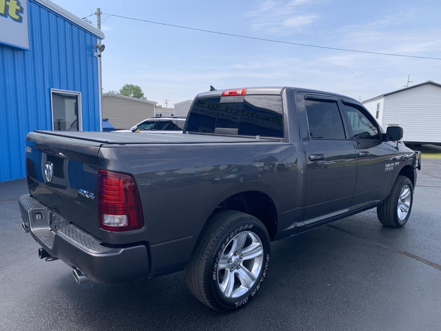 2015 GRAY /Black Leather/Cloth RAM 1500 SPORT (1C6RR7MT7FS) with an 5.7L V8 engine, Automatic transmission, located at 506 S. Kingshighway, Cape Girardeau, MO, 63703, (573) 235-5000, 37.294991, -89.553635 - 2015 Ram 1500 Sport 167xxx miles 4x4 5.7L V8 Automatic Leather Navigation Backup Camera Heated Seats Heated Steering Wheel Power Driver Seat Power Running Boards Bluetooth 20" Wheels Cruise Remote Start Power Windows/Locks/Mirrors We have financing available and we accept trades! Fi - Photo#9
