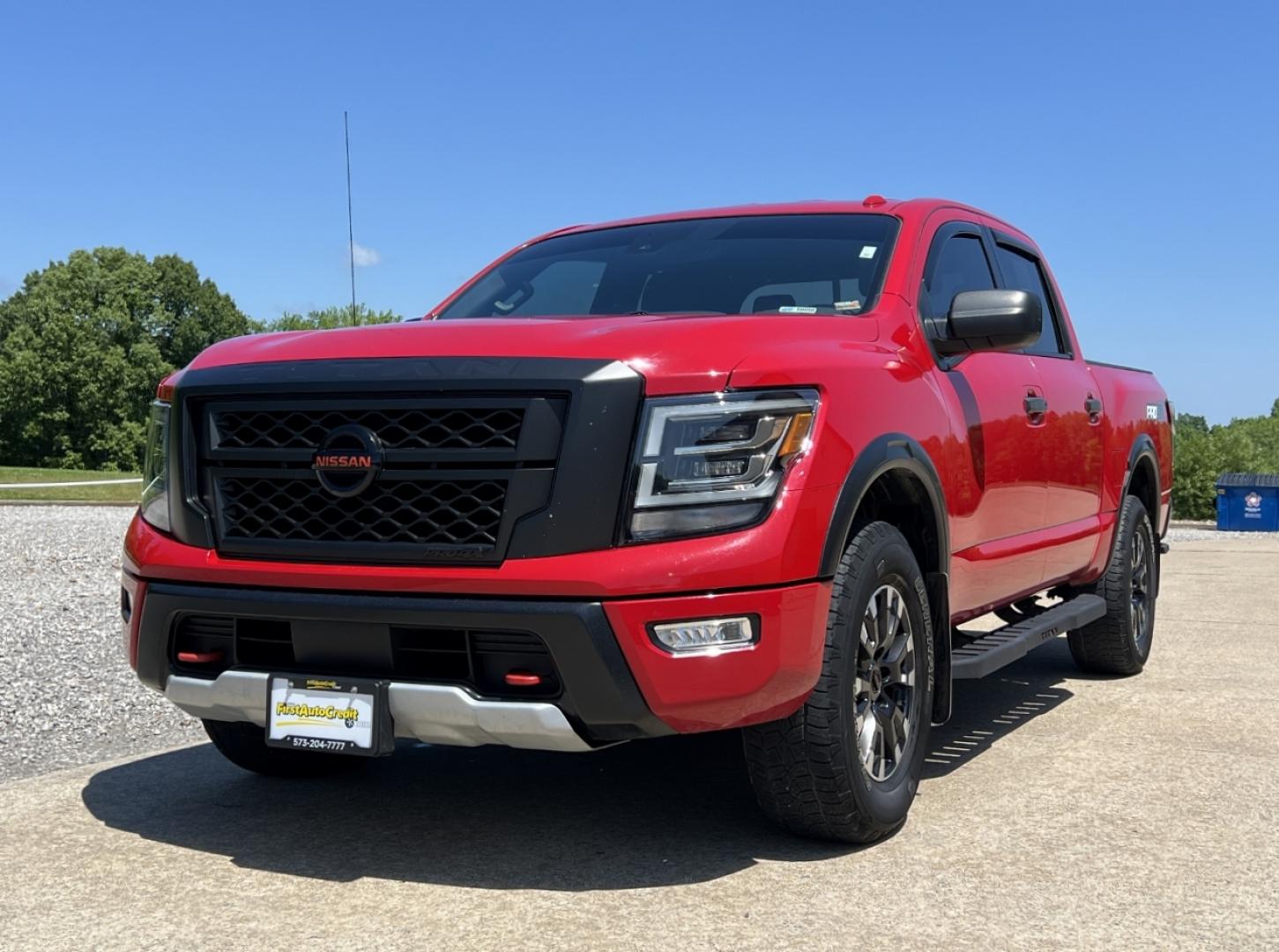 2021 RED /Black Leather/Cloth Nissan Titan PRO-4X (1N6AA1ED5MN) with an 5.6L V8 engine, Automatic transmission, located at 506 S. Kingshighway, Cape Girardeau, MO, 63703, (573) 235-5000, 37.294991, -89.553635 - 2021 Nissan Titan PRO-4X 1-Owner 136xxx miles 4x4 5.6L V8 Automatic Navigation Backup Camera Power Driver Seat Bluetooth Cruise Power Windows/Locks/Mirrors We have financing available and we accept trades! Fill out a credit application on our website or come by today! If you have any qu - Photo#6