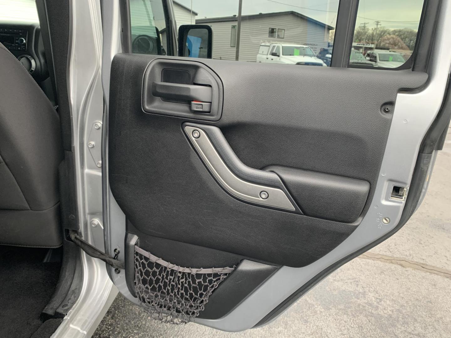 2015 GRAY /Black Cloth Jeep Wrangler Unlimited Sport 4WD (1C4BJWDG0FL) with an 3.6L V6 engine, Automatic transmission, located at 506 S. Kingshighway, Cape Girardeau, MO, 63703, (573) 235-5000, 37.294991, -89.553635 - 2015 Jeep Wrangler Unlimited Sport 205xxx miles 4x4 3.6L V6 Automatic Cruise Power Windows/Locks/Mirrors We have financing available and we accept trades! Fill out a credit application on our website or come by today! If you have any questions, give us a call at (573) 235-5000 or visit our - Photo#11