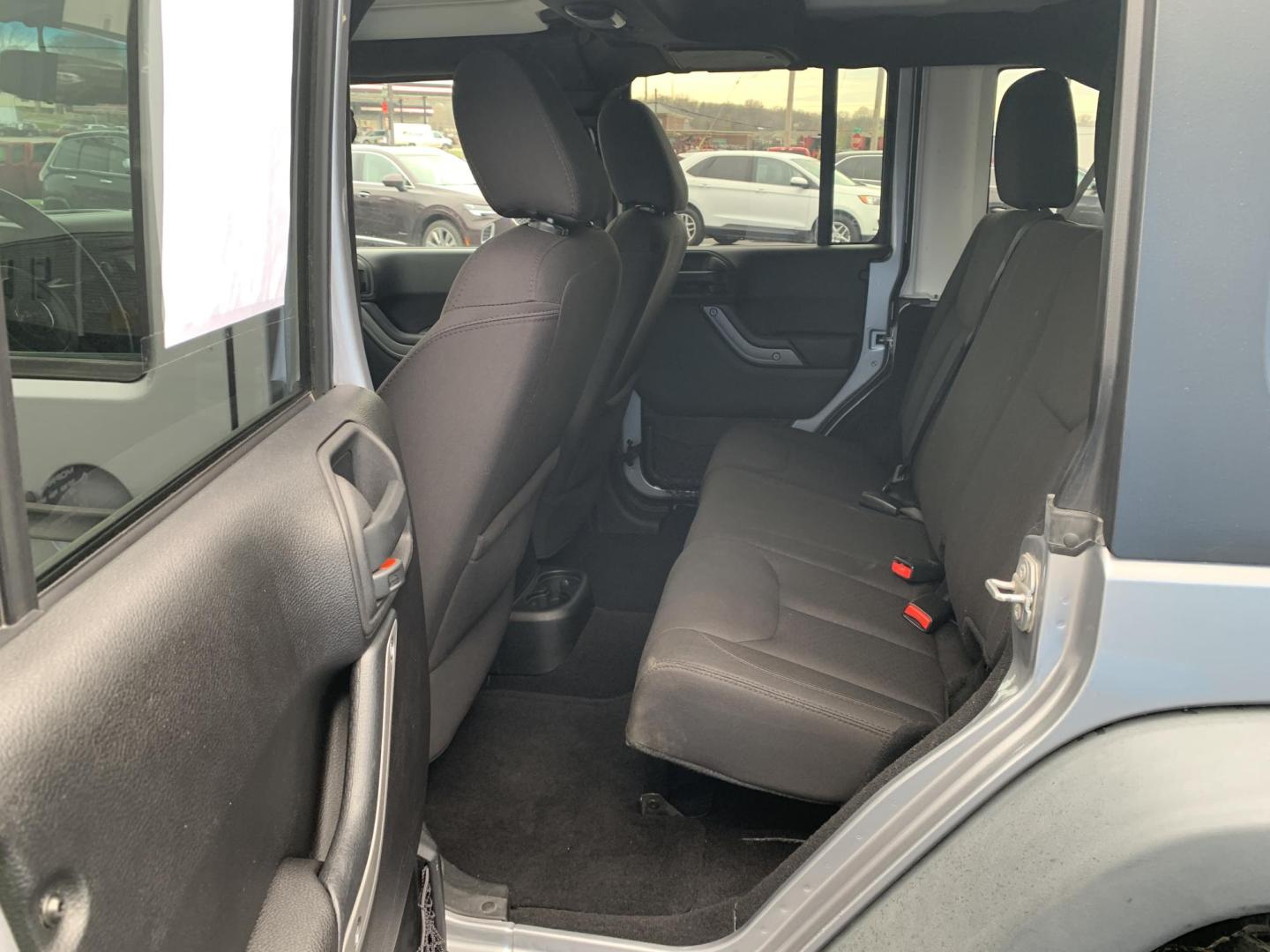 2015 GRAY /Black Cloth Jeep Wrangler Unlimited Sport 4WD (1C4BJWDG0FL) with an 3.6L V6 engine, Automatic transmission, located at 506 S. Kingshighway, Cape Girardeau, MO, 63703, (573) 235-5000, 37.294991, -89.553635 - 2015 Jeep Wrangler Unlimited Sport 205xxx miles 4x4 3.6L V6 Automatic Cruise Power Windows/Locks/Mirrors We have financing available and we accept trades! Fill out a credit application on our website or come by today! If you have any questions, give us a call at (573) 235-5000 or visit our - Photo#14