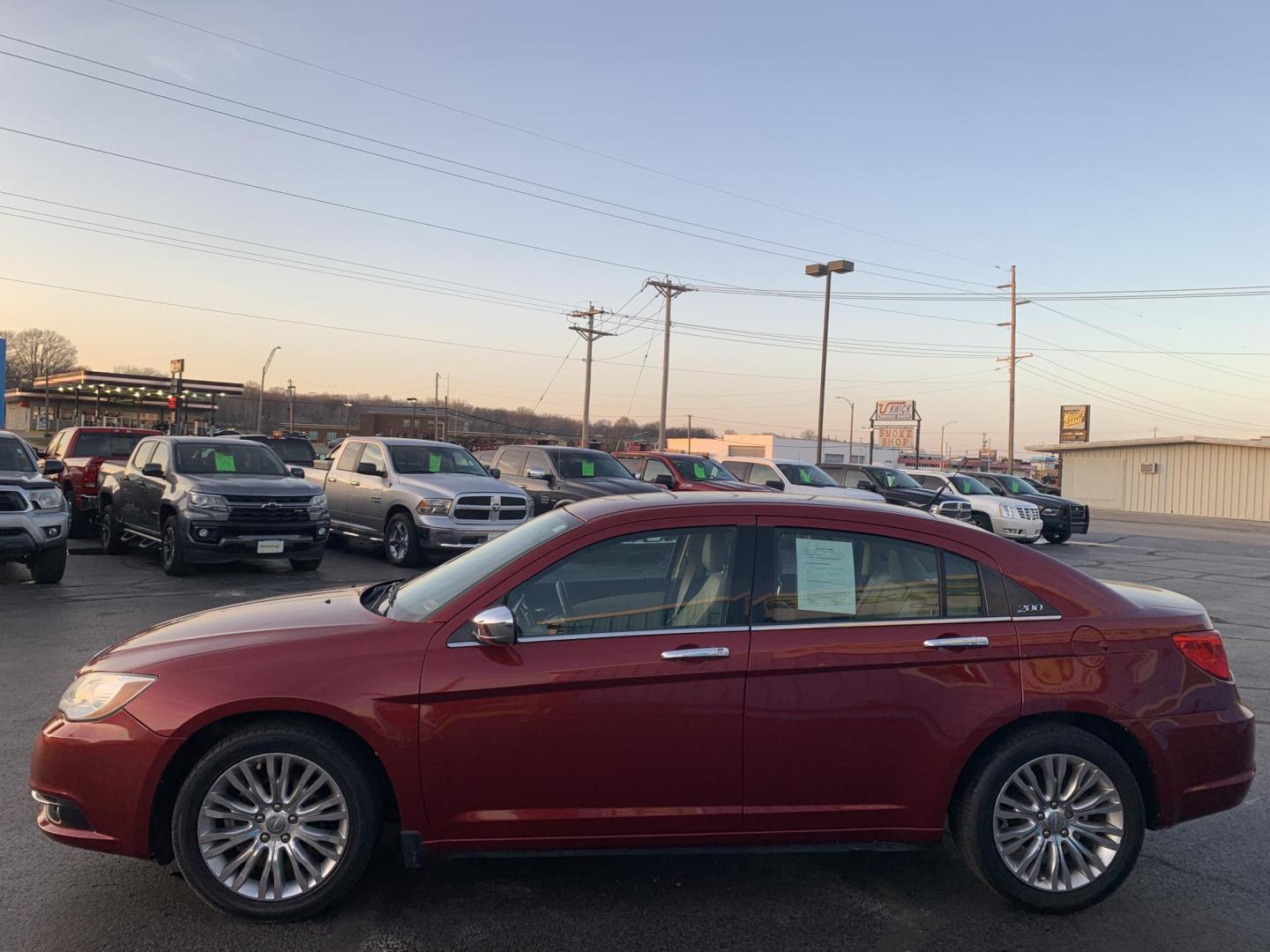 2011 MAROON /Tan Chrysler 200 Limited (1C3BC2FGXBN) with an 3.6L V6 DOHC 24V engine, 6-Speed Automatic transmission, located at 506 S. Kingshighway, Cape Girardeau, MO, 63703, (573) 235-5000, 37.294991, -89.553635 - 2011 Chrysler 200 Limited 77xxx miles Front Wheel Drive 3.6L 6 Cyl. Automatic Cruise Heated Seats Power Driver Seat Power Sunroof Leather Navigation Power Windows/Locks/Mirrors We have financing available and we accept trades! Fill out a credit application on our website or come by today - Photo#3
