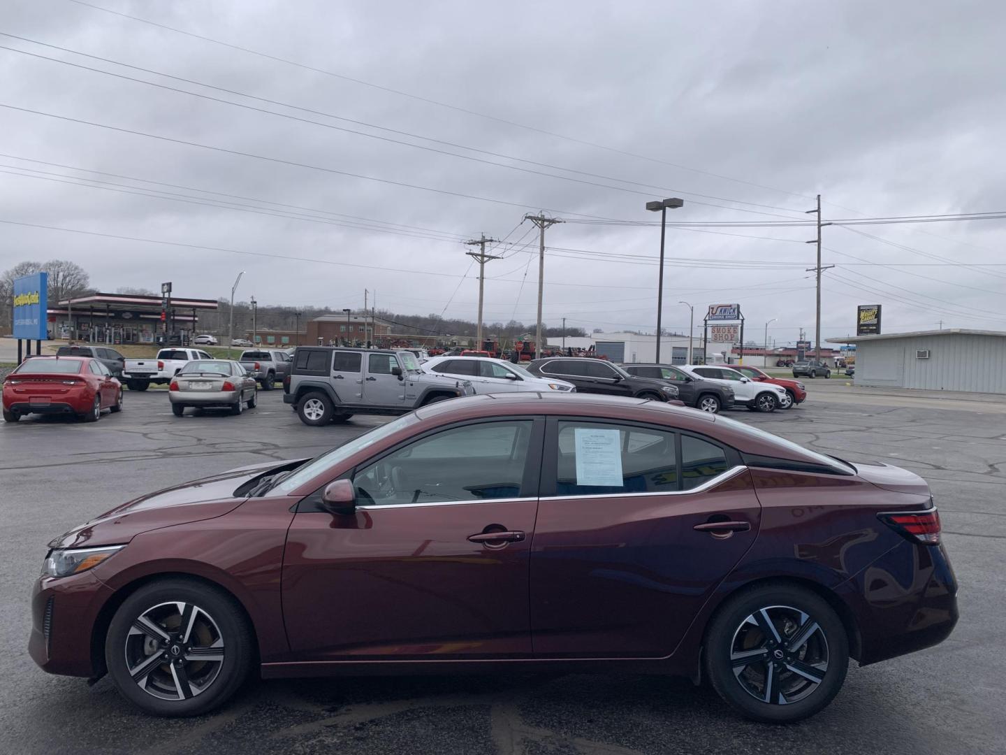 2024 BURGUNDY /Black Cloth Nissan Sentra SV (3N1AB8CV6RY) with an 2.0L 4 Cyl. engine, Automatic transmission, located at 506 S. Kingshighway, Cape Girardeau, MO, 63703, (573) 235-5000, 37.294991, -89.553635 - 2024 Nissan Sentra SV 1-Owner 88xxx miles Front Wheel Drive 2.0L 4 Cyl. Automatic Backup Camera Bluetooth Cruise Power Windows/Locks/Mirrors We have financing available and we accept trades! Fill out a credit application on our website or come by today! If you have any questions, give u - Photo#4