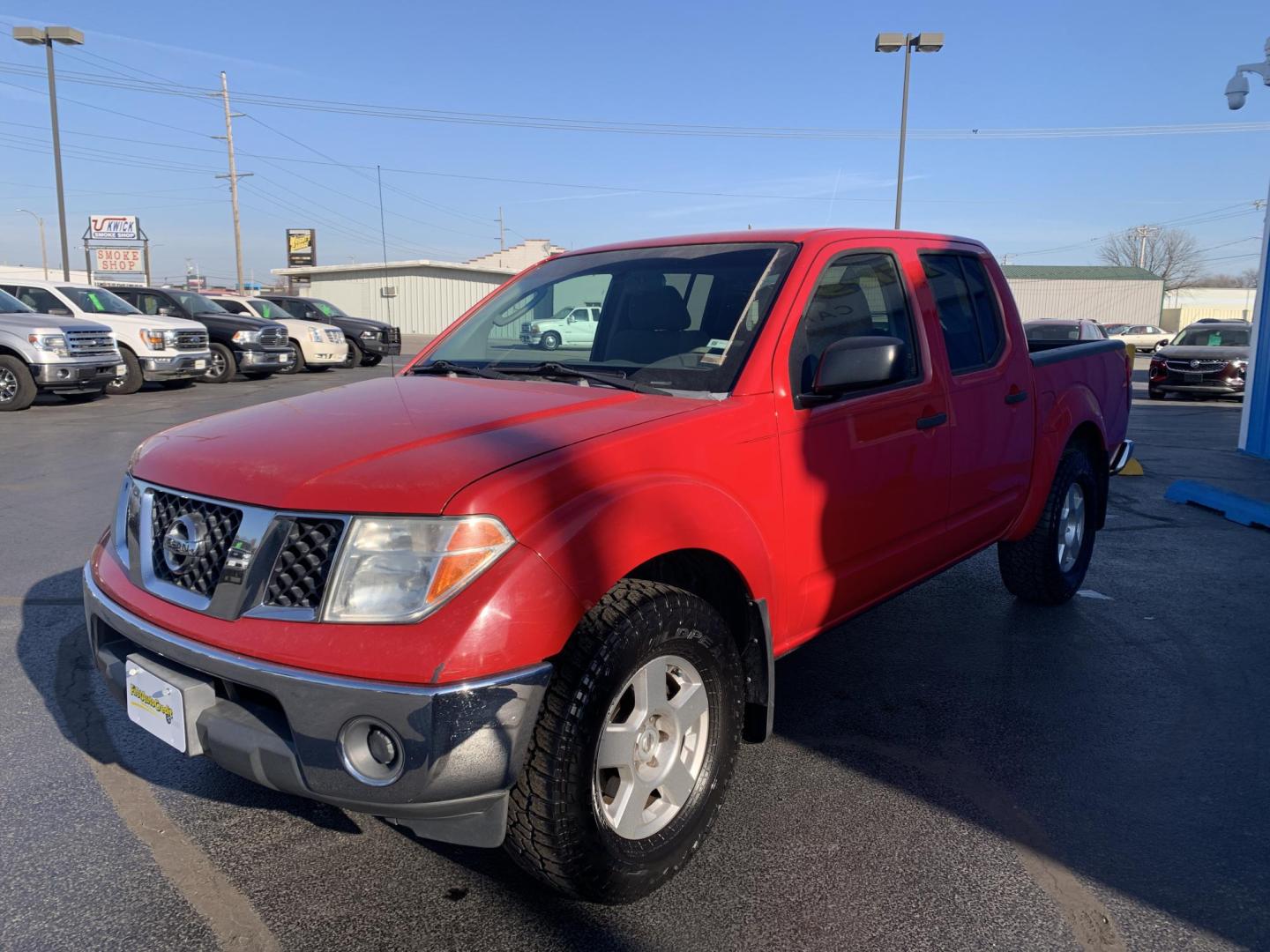 2007 RED /GRAY Nissan Frontier LE Crew Cab 2WD (1N6AD07U37C) with an 4.0L V6 DOHC 24V engine, 5-Speed Automatic Overdrive transmission, located at 506 S. Kingshighway, Cape Girardeau, MO, 63703, (573) 235-5000, 37.294991, -89.553635 - 2007 Nissan Frontier LE Air Conditioning Power Steering Tilt Whee Dual Air Bags Front and Sides Crew Cab Regular Bed All Wheel ABS We have financing available and we accept trades! Fill out a credit application on our website or come by today! If you have any questions, give us a call at - Photo#2