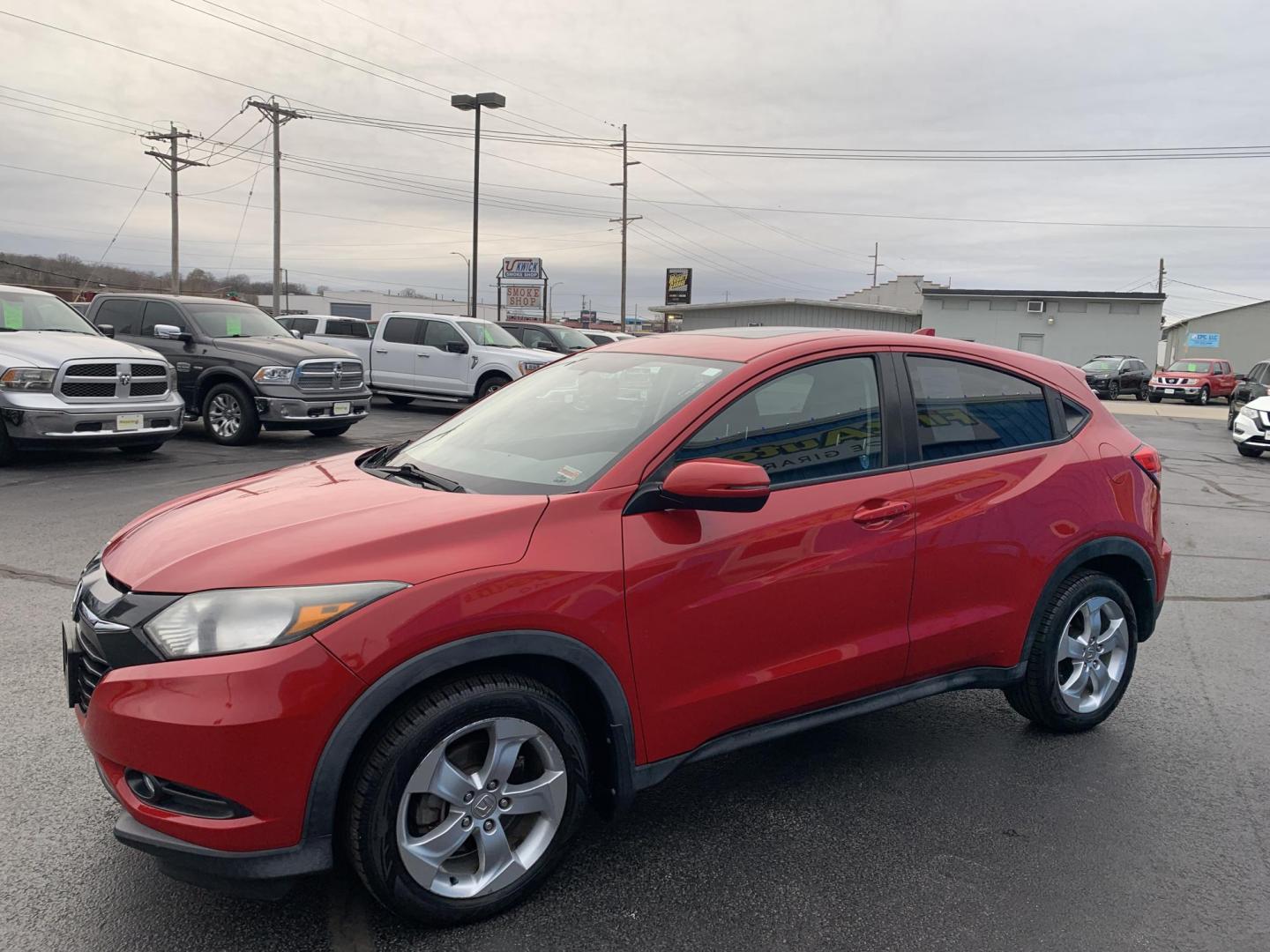 2016 RED /BLACK Honda HR-V EX (3CZRU6H57GM) with an 1.8L L4 DOHC 16V engine, Automatic transmission, located at 506 S. Kingshighway, Cape Girardeau, MO, 63703, (573) 235-5000, 37.294991, -89.553635 - 2016 Honda HR-V 137,xxx Miles Automatic Heated Seats Backup Camera Sunroof All Wheel Drive Power Windows/Locks/Mirrors Bluetooth We have financing available and we accept trades! Fill out a credit application on our website or come by today! If you have any questions, give us a call at ( - Photo#2