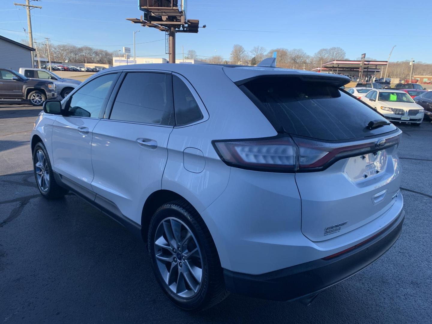 2015 WHITE /BLACK Ford Edge Titanium (2FMPK3K96FB) with an 2.0L L4 DOHC 16V engine, Automatic transmission, located at 506 S. Kingshighway, Cape Girardeau, MO, 63703, (573) 235-5000, 37.294991, -89.553635 - 2015 Ford Edge Titanium 2.0L 4 Cyl. Automatic Leather Navigation Backup Camera Power/Heated Seats Bluetooth Cruise Power Windows/Locks/Mirrors We have financing available and we accept trades! Fill out a credit application on our website or come by today! If you have - Photo#4