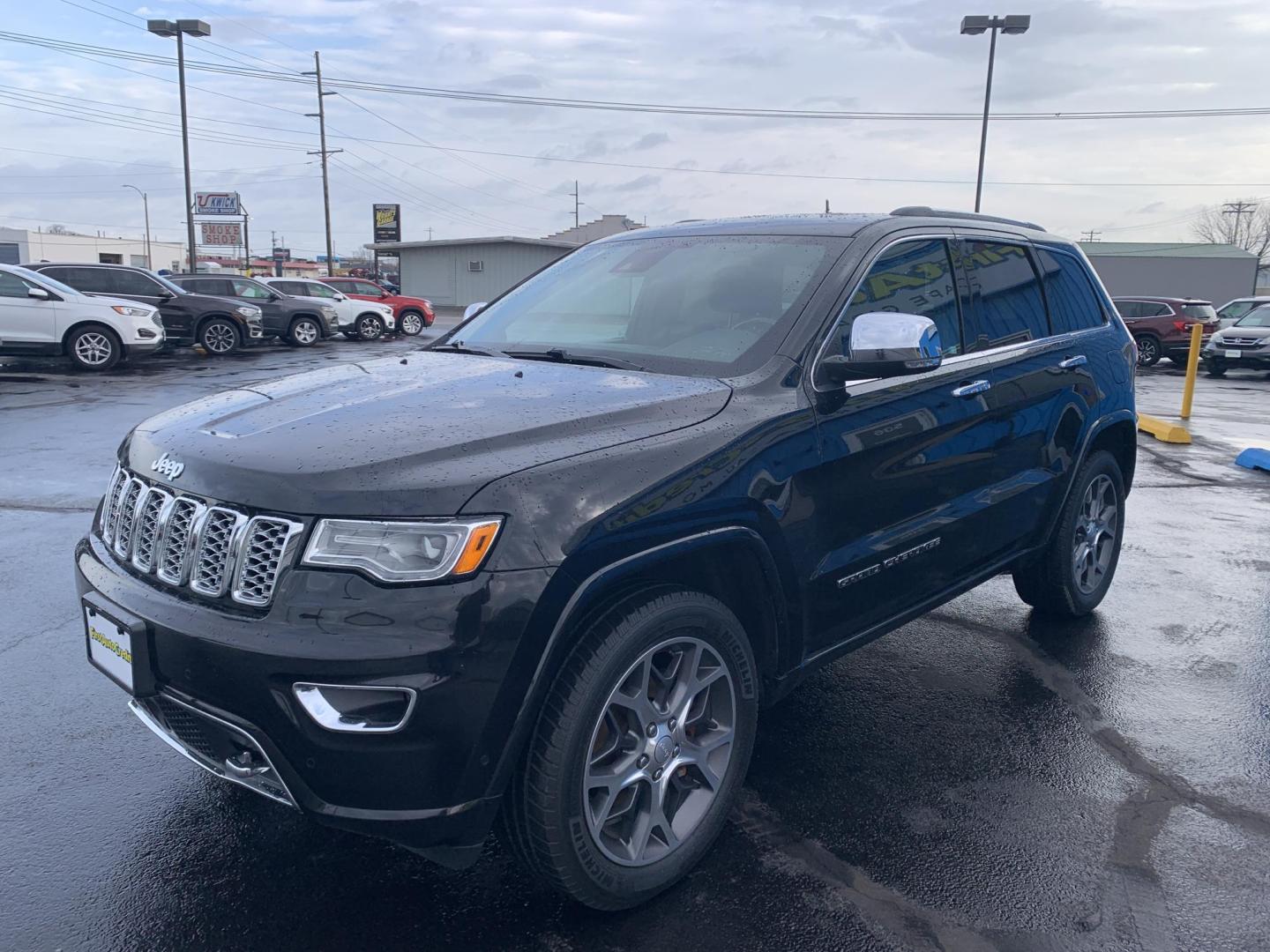 2019 BLACK /BLACK Jeep Grand Cherokee Overland 4WD (1C4RJFCG1KC) with an 3.6L V6 DOHC 24V engine, Automatic transmission, located at 506 S. Kingshighway, Cape Girardeau, MO, 63703, (573) 235-5000, 37.294991, -89.553635 - 2019 Jeep Grand Cherokee Overland 4WD Only 74,xxx miles Alarm System Bluetooth Cruise Control Dual Power Front Seats Folding Rear Seat Heated Seats Heated Steering Wheel Integrated Garage Door Opener Leather Seats Navigation System Power Driver's Seat Power Windows Rear Window Defroste - Photo#2