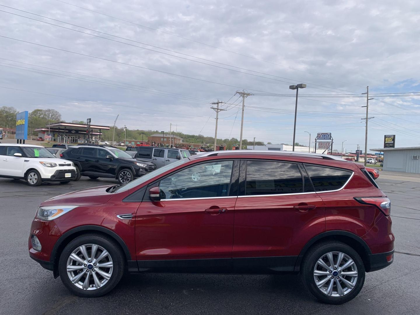 2017 MAROON /TAN Ford Escape Titanium FWD (1FMCU0J92HU) with an 2.0L L4 DOHC 16V engine, Automatic transmission, located at 506 S. Kingshighway, Cape Girardeau, MO, 63703, (573) 235-5000, 37.294991, -89.553635 - 2017 Ford Escape Titanium 93,xxx miles Leather Seats Heated Seats Backup Camera Bluetooth Cruise Power Windows/Locks/Mirrors We have financing available and we accept trades! Fill out a credit application on our website or come by today! If you have any questions, give us a call at (573 - Photo#3
