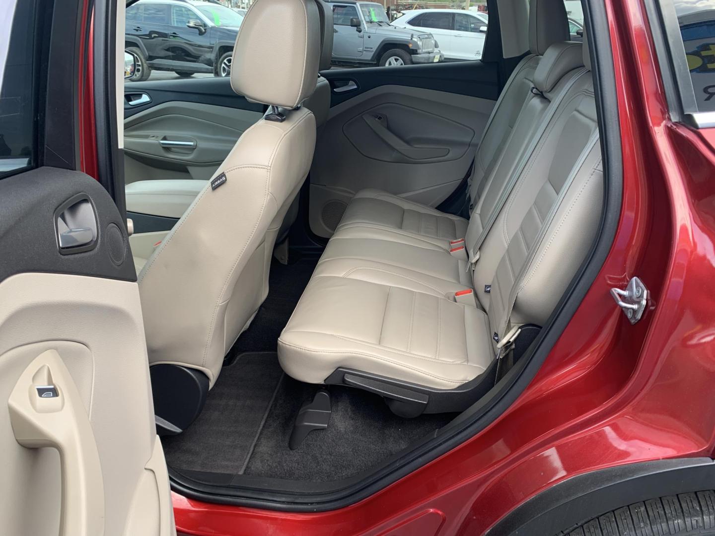 2017 MAROON /TAN Ford Escape Titanium FWD (1FMCU0J92HU) with an 2.0L L4 DOHC 16V engine, Automatic transmission, located at 506 S. Kingshighway, Cape Girardeau, MO, 63703, (573) 235-5000, 37.294991, -89.553635 - 2017 Ford Escape Titanium 93,xxx miles Leather Seats Heated Seats Backup Camera Bluetooth Cruise Power Windows/Locks/Mirrors We have financing available and we accept trades! Fill out a credit application on our website or come by today! If you have any questions, give us a call at (573 - Photo#17