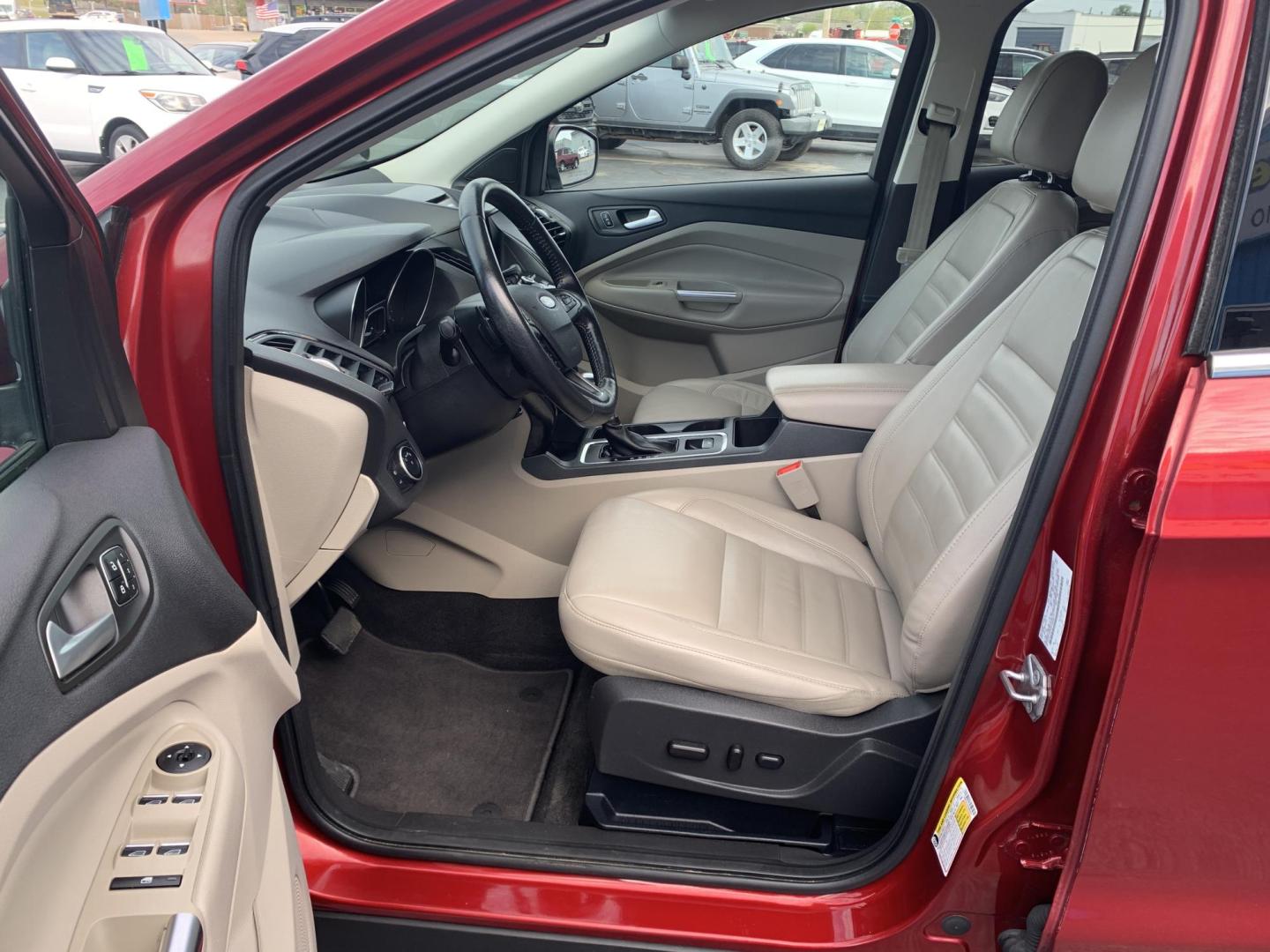 2017 MAROON /TAN Ford Escape Titanium FWD (1FMCU0J92HU) with an 2.0L L4 DOHC 16V engine, Automatic transmission, located at 506 S. Kingshighway, Cape Girardeau, MO, 63703, (573) 235-5000, 37.294991, -89.553635 - 2017 Ford Escape Titanium 93,xxx miles Leather Seats Heated Seats Backup Camera Bluetooth Cruise Power Windows/Locks/Mirrors We have financing available and we accept trades! Fill out a credit application on our website or come by today! If you have any questions, give us a call at (573 - Photo#19