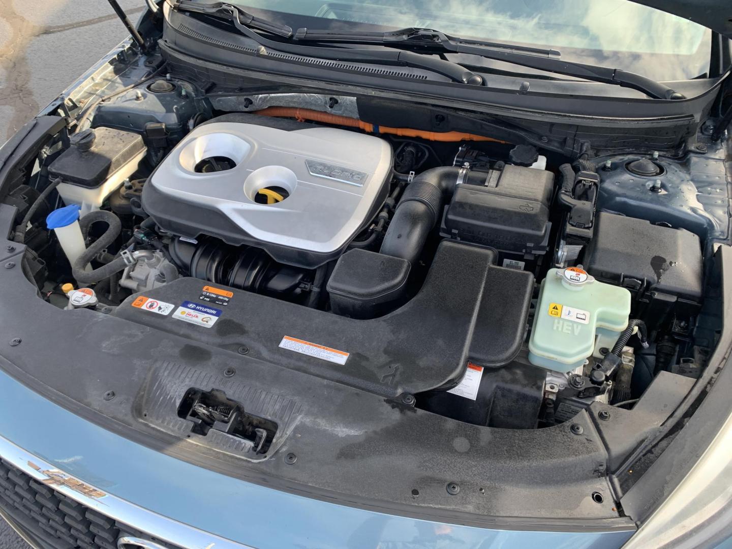 2016 BLUE /GRAY Hyundai Sonata Hybrid Base (KMHE24L14GA) with an 2.0L L4 DOHC 16V HYBRID engine, Automatic transmission, located at 506 S. Kingshighway, Cape Girardeau, MO, 63703, (573) 235-5000, 37.294991, -89.553635 - 2016 Hyundai Sonata Hybrid Base 134,xxx miles Front Wheel Drive Cloth Seats Power Windows Rear Window Defroster Power Outlet Steering Wheel Controls Tilt Steering Wheel Alarm System Bluetooth Wireless Cruise Control Hands Free Phone Remote Keyless Entry Proximity Sensing Keyless Entry - Photo#2