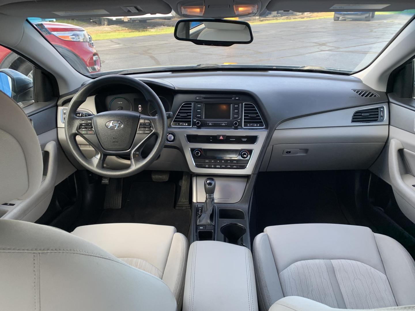 2016 BLUE /GRAY Hyundai Sonata Hybrid Base (KMHE24L14GA) with an 2.0L L4 DOHC 16V HYBRID engine, Automatic transmission, located at 506 S. Kingshighway, Cape Girardeau, MO, 63703, (573) 235-5000, 37.294991, -89.553635 - 2016 Hyundai Sonata Hybrid Base 134,xxx miles Front Wheel Drive Cloth Seats Power Windows Rear Window Defroster Power Outlet Steering Wheel Controls Tilt Steering Wheel Alarm System Bluetooth Wireless Cruise Control Hands Free Phone Remote Keyless Entry Proximity Sensing Keyless Entry - Photo#14