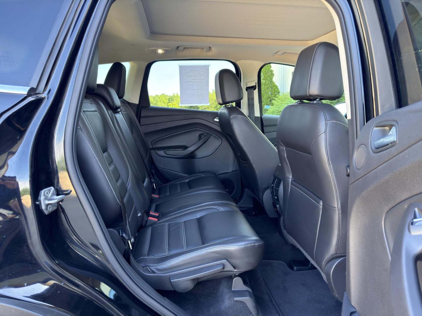 2017 BLACK /Black Ford Escape Titanium 4WD (1FMCU9J91HU) with an 2.0L 4 Cyl. engine, Automatic transmission, located at 2990 Old Orchard Rd., Jackson, MO, 63755, 37.354214, -89.612106 - 2017 Ford Escape Titanium 99xxx miles 4 Wheel Drive 2.0L 4 Cyl. Automatic Leather Backup Camera Power/Heated Seats Sunroof Bluetooth Remote Start Cruise Power Windows/Locks/Mirrors We have financing available and we accept trades! Fill out a credit application on our website or come by - Photo#19