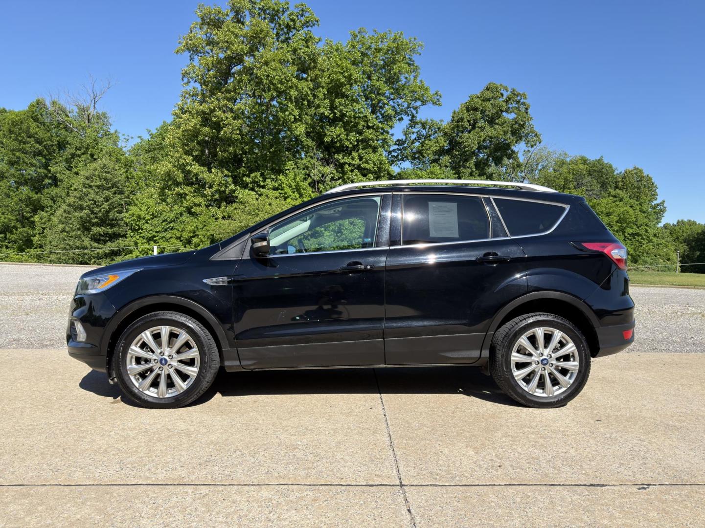 2017 BLACK /Black Ford Escape Titanium 4WD (1FMCU9J91HU) with an 2.0L 4 Cyl. engine, Automatic transmission, located at 2990 Old Orchard Rd., Jackson, MO, 63755, 37.354214, -89.612106 - 2017 Ford Escape Titanium 99xxx miles 4 Wheel Drive 2.0L 4 Cyl. Automatic Leather Backup Camera Power/Heated Seats Sunroof Bluetooth Remote Start Cruise Power Windows/Locks/Mirrors We have financing available and we accept trades! Fill out a credit application on our website or come by - Photo#8