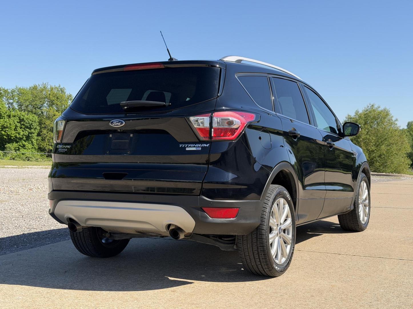 2017 BLACK /Black Ford Escape Titanium 4WD (1FMCU9J91HU) with an 2.0L 4 Cyl. engine, Automatic transmission, located at 2990 Old Orchard Rd., Jackson, MO, 63755, 37.354214, -89.612106 - 2017 Ford Escape Titanium 99xxx miles 4 Wheel Drive 2.0L 4 Cyl. Automatic Leather Backup Camera Power/Heated Seats Sunroof Bluetooth Remote Start Cruise Power Windows/Locks/Mirrors We have financing available and we accept trades! Fill out a credit application on our website or come by - Photo#10