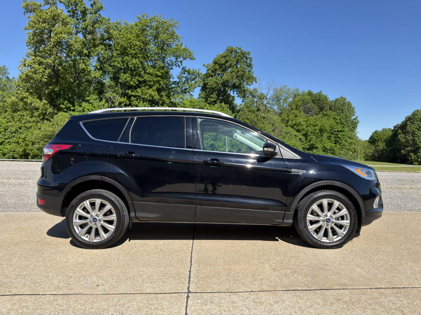 2017 BLACK /Black Ford Escape Titanium 4WD (1FMCU9J91HU) with an 2.0L 4 Cyl. engine, Automatic transmission, located at 2990 Old Orchard Rd., Jackson, MO, 63755, 37.354214, -89.612106 - 2017 Ford Escape Titanium 99xxx miles 4 Wheel Drive 2.0L 4 Cyl. Automatic Leather Backup Camera Power/Heated Seats Sunroof Bluetooth Remote Start Cruise Power Windows/Locks/Mirrors We have financing available and we accept trades! Fill out a credit application on our website or come by - Photo#9