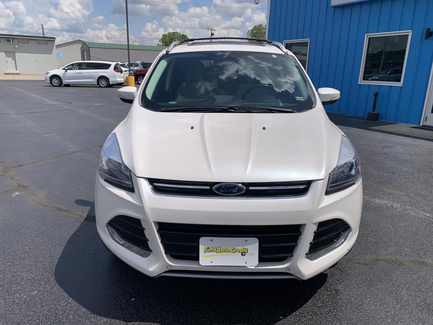 2014 WHITE /TAN Ford Escape Titanium 4WD (1FMCU9J92EU) with an 2.0L L4 DOHC 16V engine, Automatic transmission, located at 506 S. Kingshighway, Cape Girardeau, MO, 63703, (573) 235-5000, 37.294991, -89.553635 - 2014 Ford Escape Titanium 4WD 115,xxx miles Heated Seats Power Seat Sunroof 4WD Backup Cam Leather Keyless Entry Remote Start Power Windows/Locks/Mirrors We have financing available and we accept trades! Fill out a credit application on our website or come by today! If you have any q - Photo#1