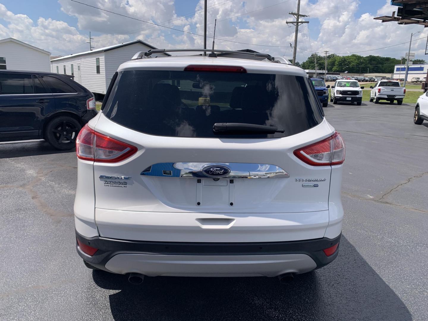 2014 WHITE /TAN Ford Escape Titanium 4WD (1FMCU9J92EU) with an 2.0L L4 DOHC 16V engine, Automatic transmission, located at 506 S. Kingshighway, Cape Girardeau, MO, 63703, (573) 235-5000, 37.294991, -89.553635 - 2014 Ford Escape Titanium 4WD 115,xxx miles Heated Seats Power Seat Sunroof 4WD Backup Cam Leather Keyless Entry Remote Start Power Windows/Locks/Mirrors We have financing available and we accept trades! Fill out a credit application on our website or come by today! If you have any q - Photo#6