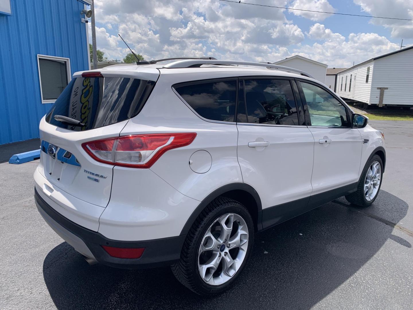 2014 WHITE /TAN Ford Escape Titanium 4WD (1FMCU9J92EU) with an 2.0L L4 DOHC 16V engine, Automatic transmission, located at 506 S. Kingshighway, Cape Girardeau, MO, 63703, (573) 235-5000, 37.294991, -89.553635 - 2014 Ford Escape Titanium 4WD 115,xxx miles Heated Seats Power Seat Sunroof 4WD Backup Cam Leather Keyless Entry Remote Start Power Windows/Locks/Mirrors We have financing available and we accept trades! Fill out a credit application on our website or come by today! If you have any q - Photo#9