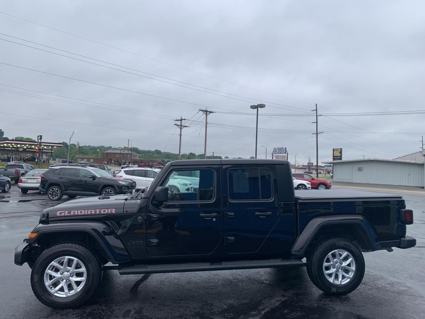 2023 BLACK /BLACK Jeep Gladiator Sport (1C6HJTAG5PL) with an 3.6L V6 DOHC 24V engine, Automatic transmission, located at 506 S. Kingshighway, Cape Girardeau, MO, 63703, (573) 235-5000, 37.294991, -89.553635 - 2023 Jeep Gladiator Sport 63,xxx miles Power Windows Removable Hardtop Cruise Bluetooth Power Mirros Backup Cam Keyless Entry Remote Start We have financing available and we accept trades! Fill out a credit application on our website or come by today! If you have any questions, give us - Photo#4