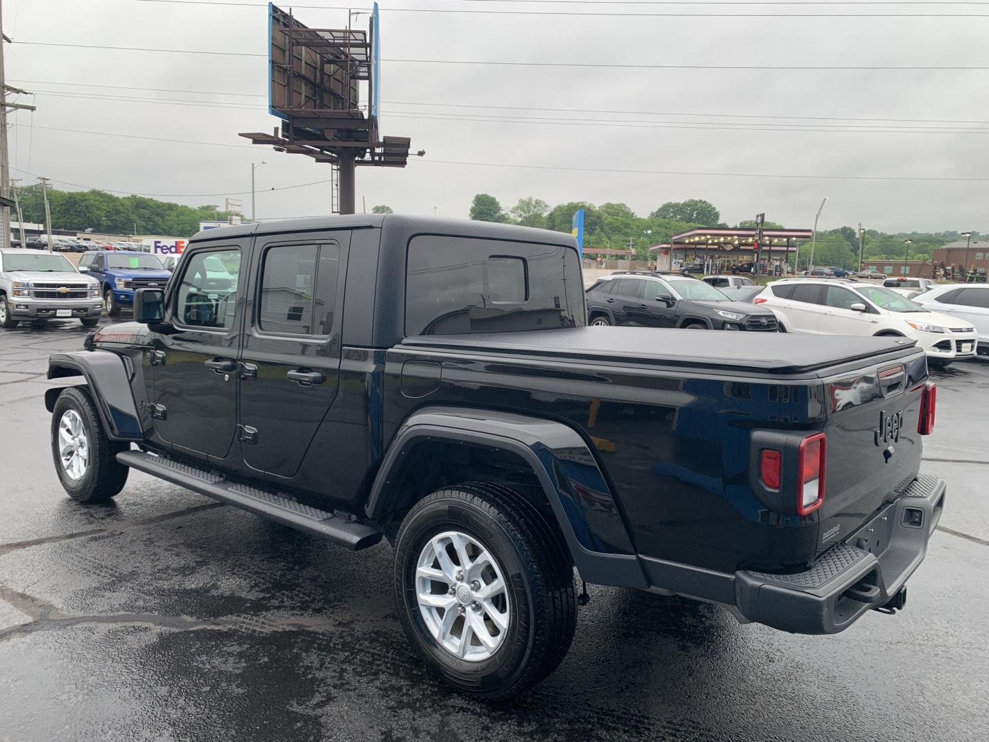 2023 BLACK /BLACK Jeep Gladiator Sport (1C6HJTAG5PL) with an 3.6L V6 DOHC 24V engine, Automatic transmission, located at 506 S. Kingshighway, Cape Girardeau, MO, 63703, (573) 235-5000, 37.294991, -89.553635 - 2023 Jeep Gladiator Sport 63,xxx miles Power Windows Removable Hardtop Cruise Bluetooth Power Mirros Backup Cam Keyless Entry Remote Start We have financing available and we accept trades! Fill out a credit application on our website or come by today! If you have any questions, give us - Photo#5